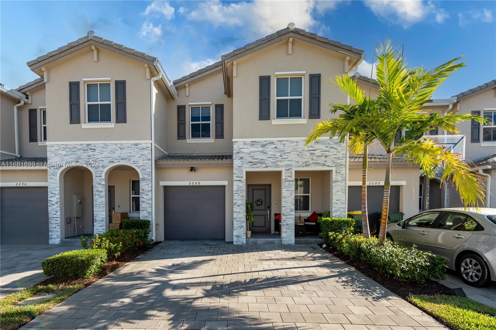 a front view of a house with a yard