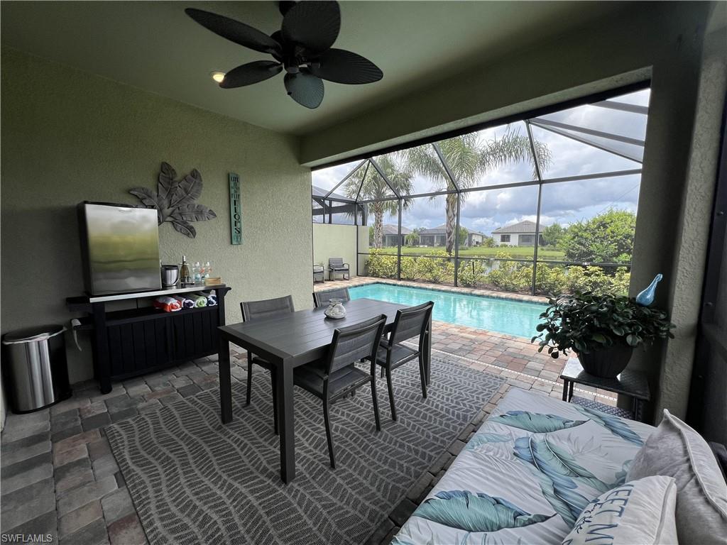 Sunroom featuring ceiling fan