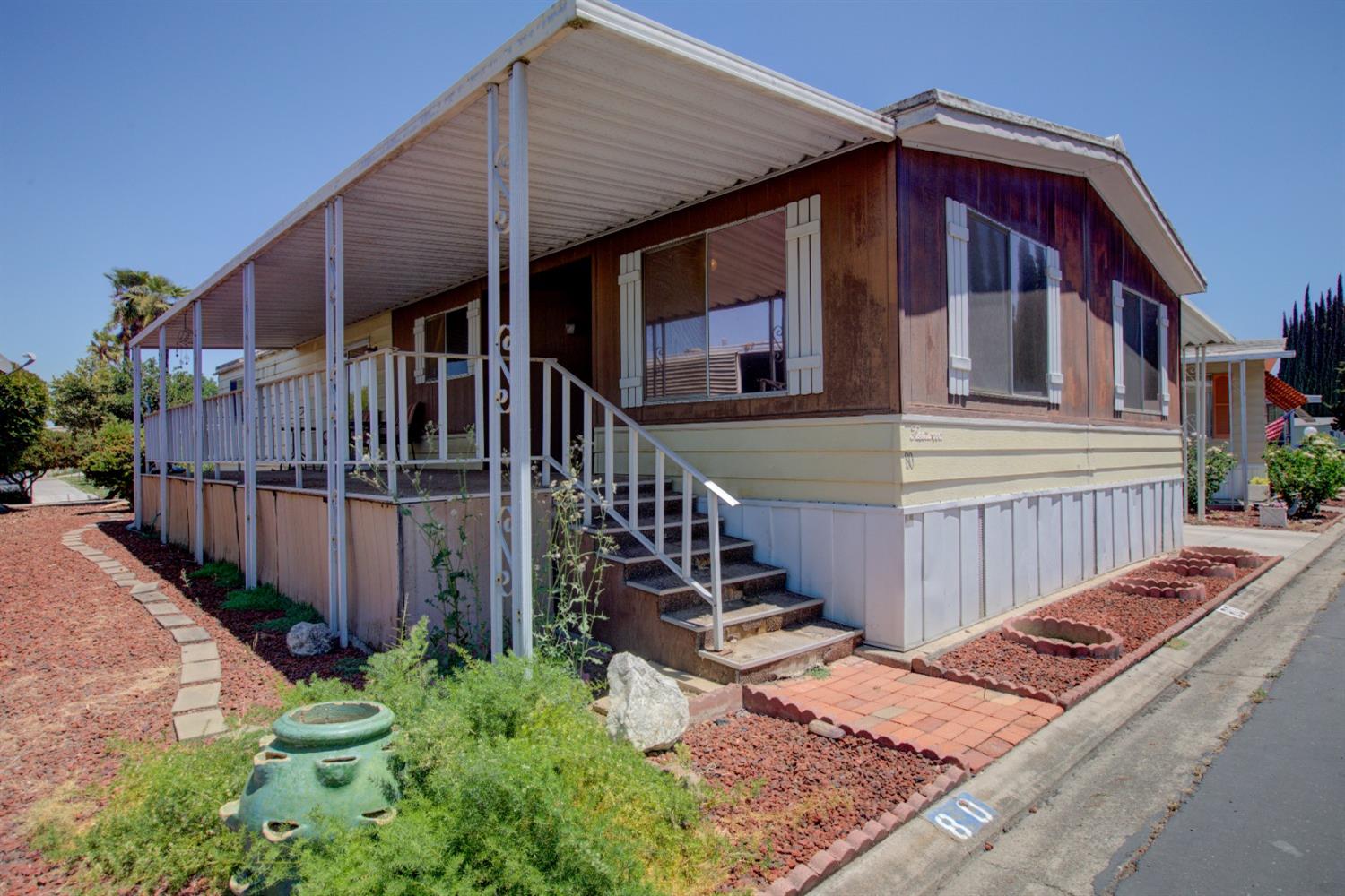 a view of a house with wooden stairs