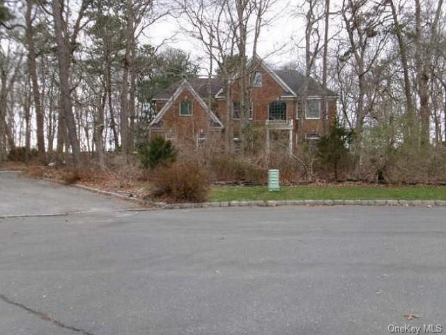 front view of a house and a yard