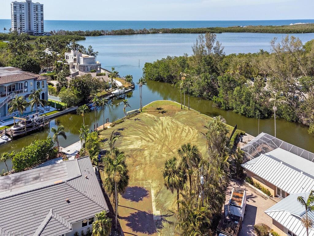 a view of a lake with a building and outdoor space