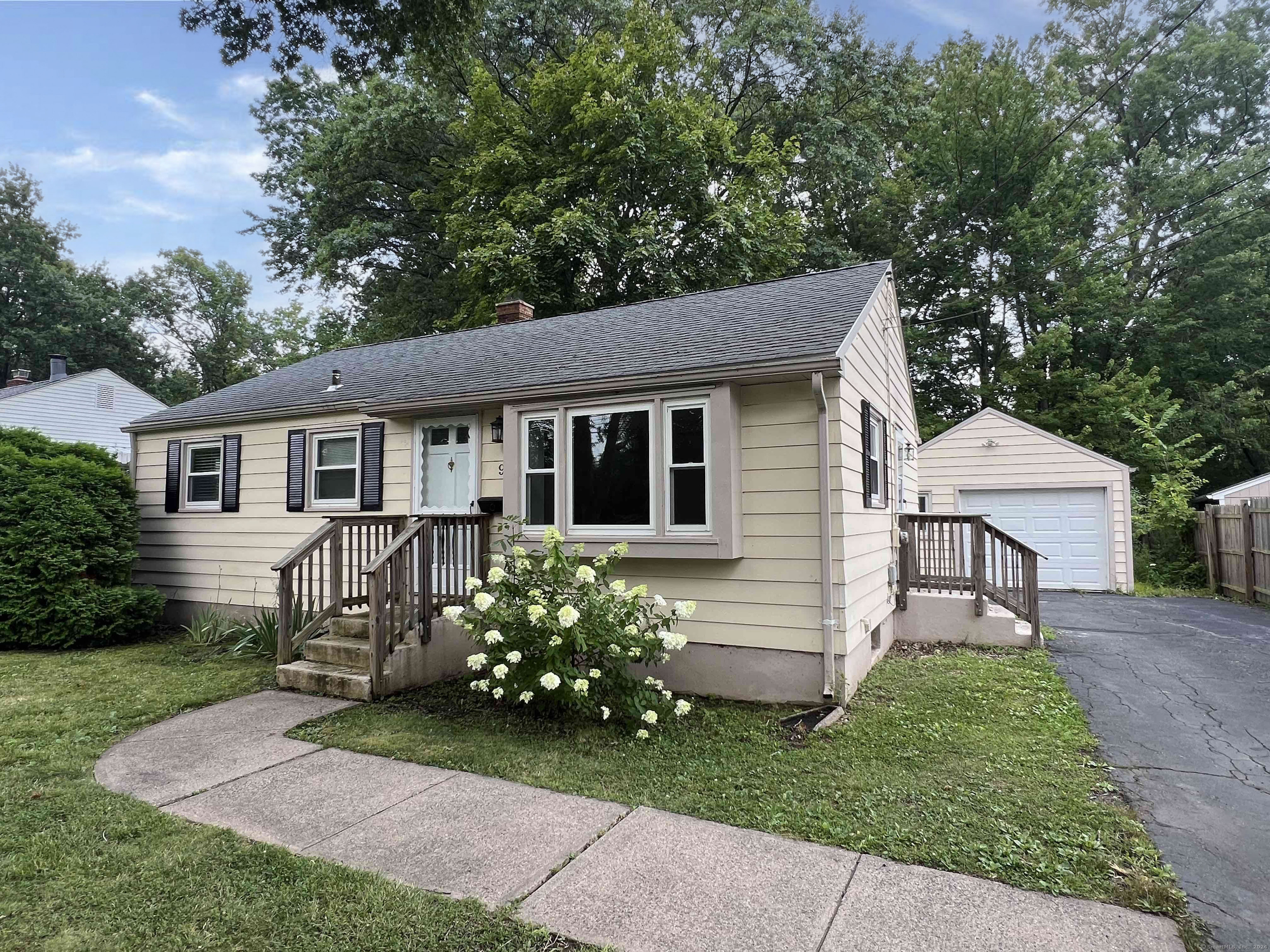 a view of a house with a yard