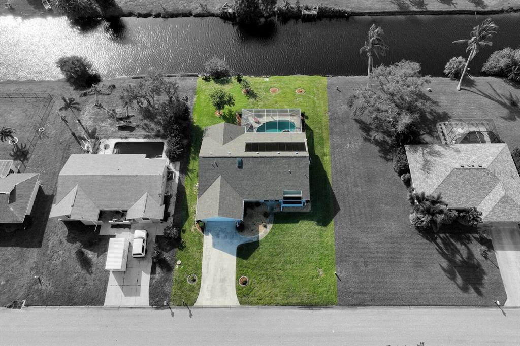 an aerial view of multiple houses with outdoor space