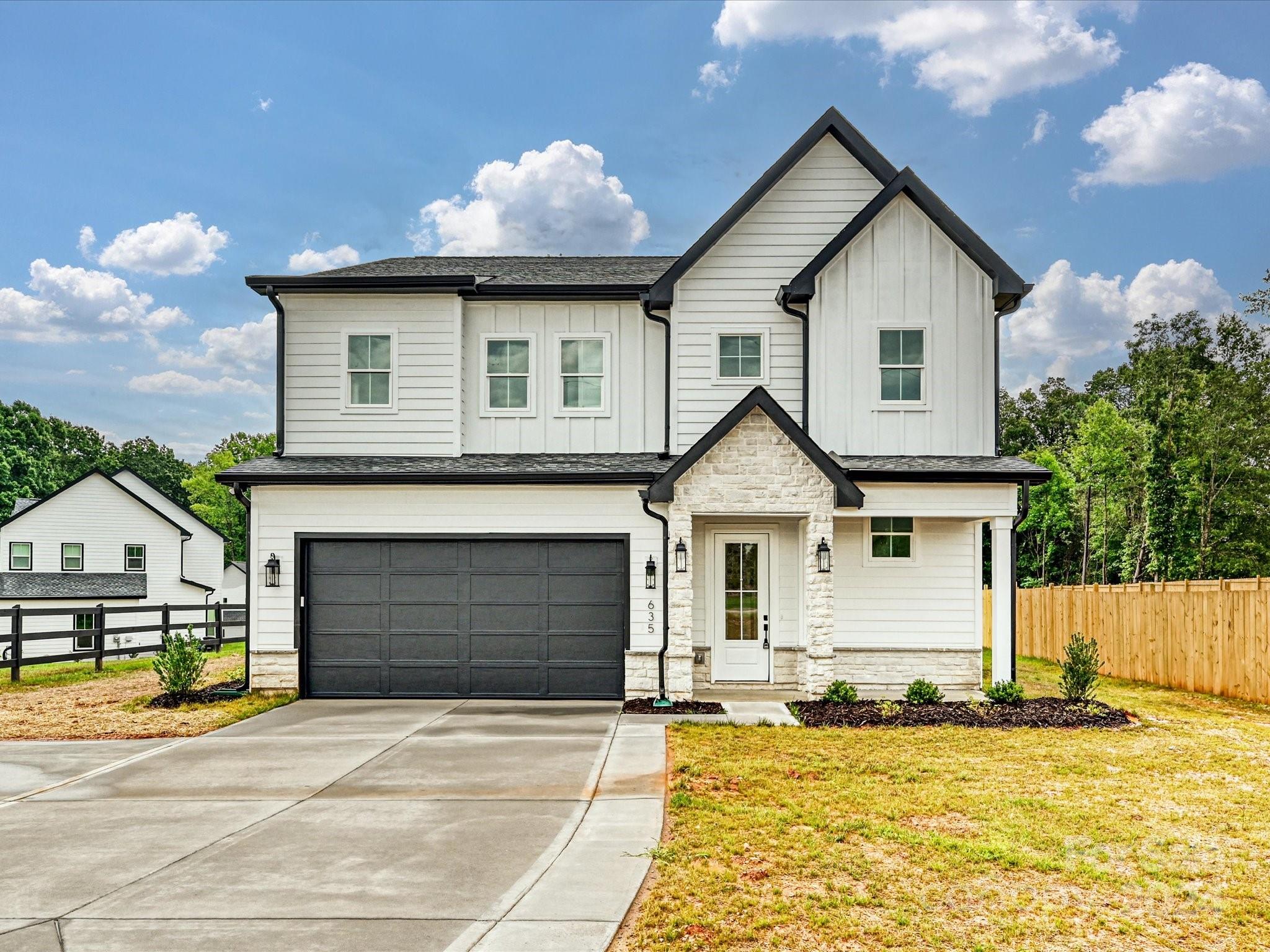 a front view of a house with yard