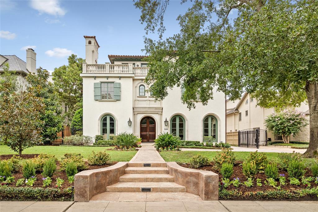 This River Oaks masterpiece by Dan Parker stands tall with its stately exterior, featuring elegant arches, warm stucco walls, and terracotta roof tiles. Surrounded by lush, manicured landscaping, the home exudes timeless sophistication and charm.