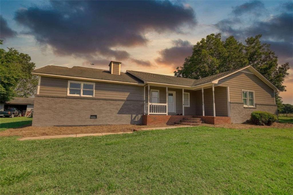 front view of a house with a yard