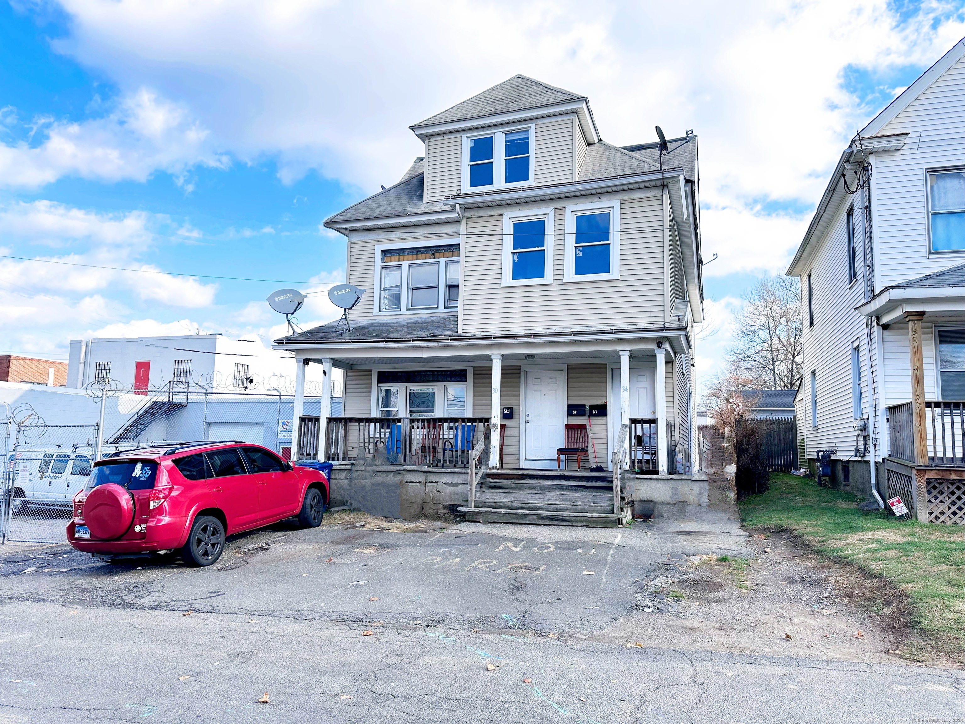 a car parked in front of a house