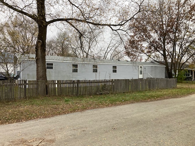 a view of a backyard of the house