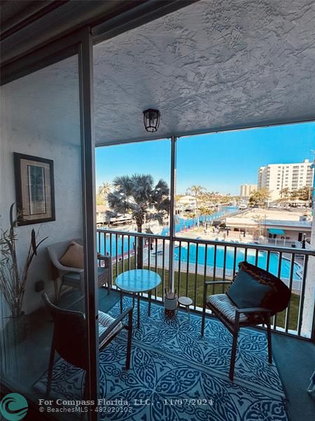 a view of a chairs and table in patio