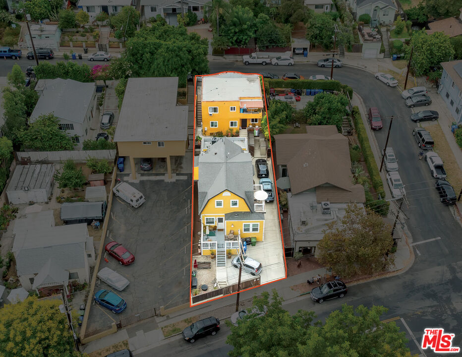 an aerial view of a house with a swimming pool