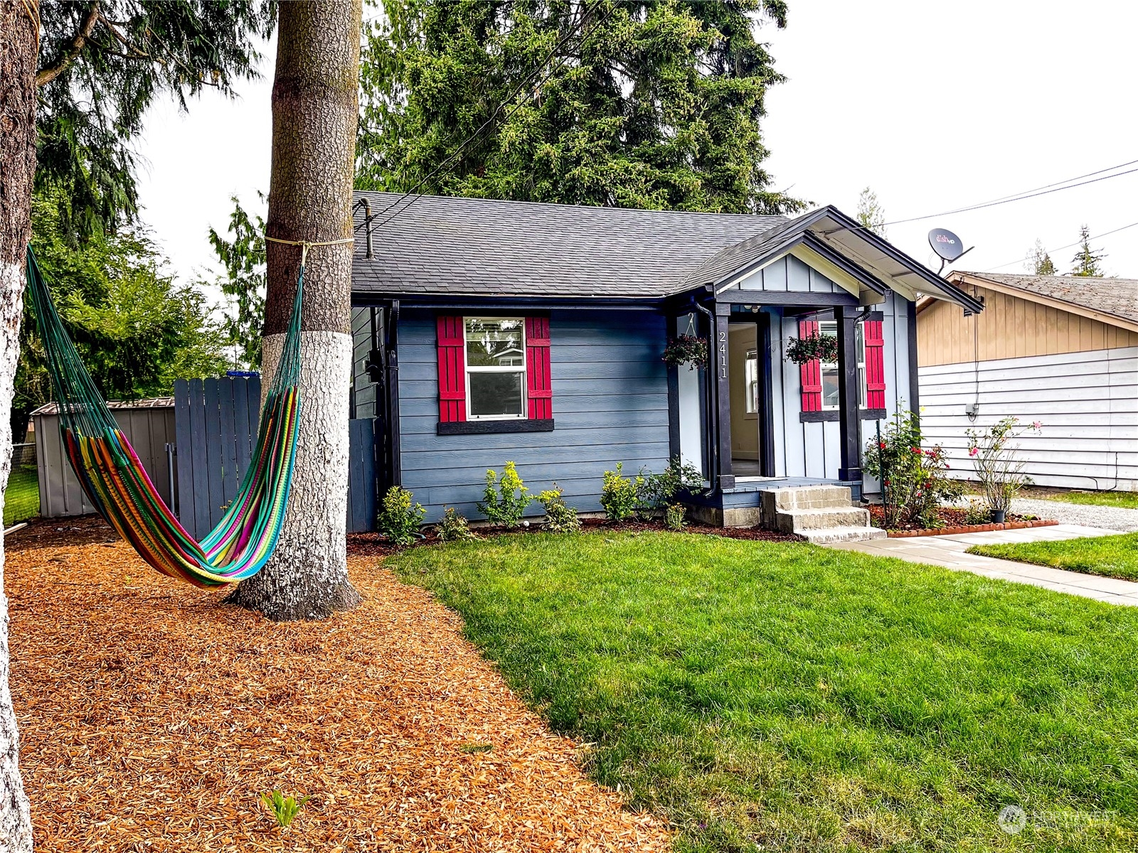 a front view of a house with garden