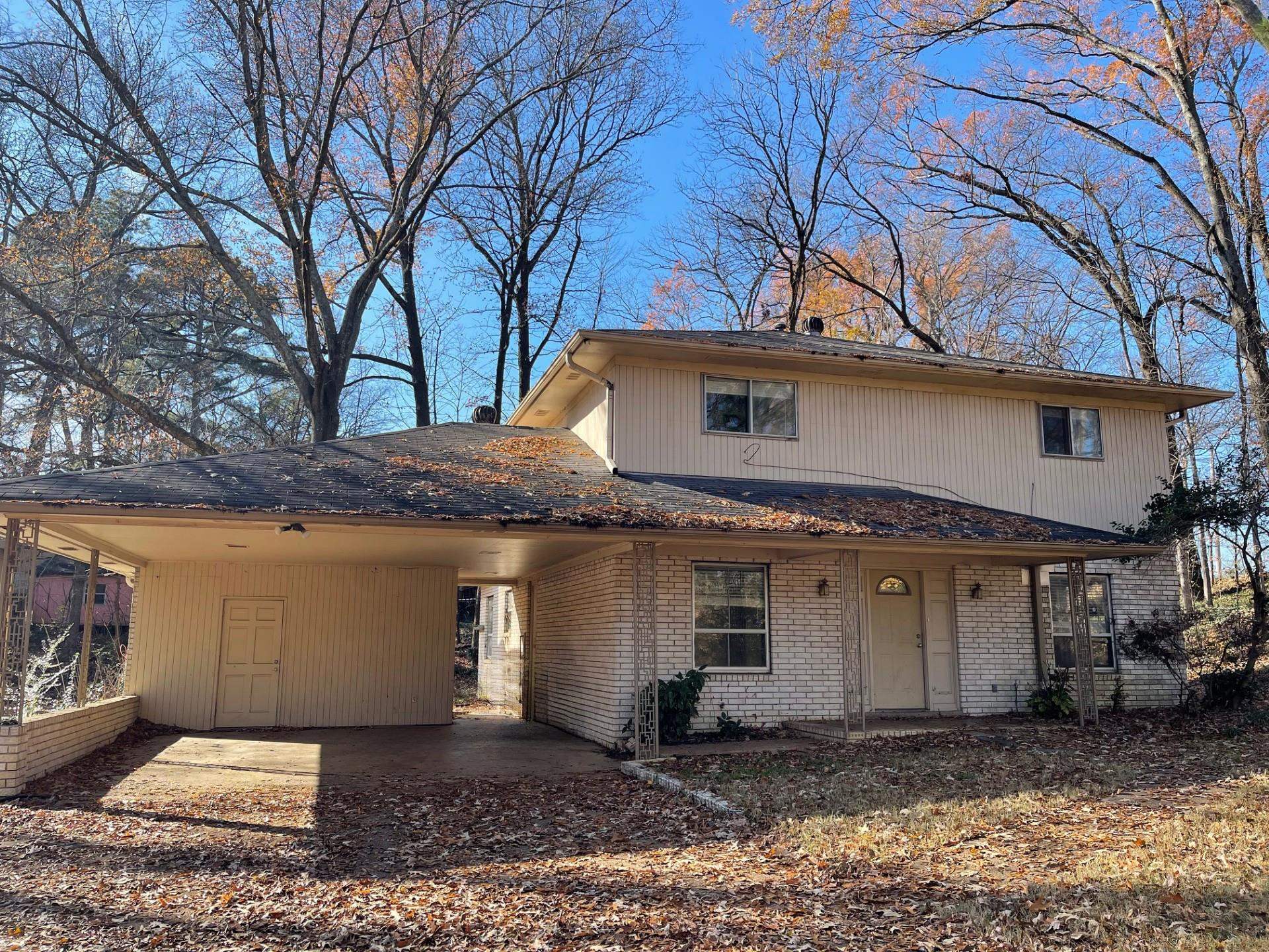 View of property with a carport