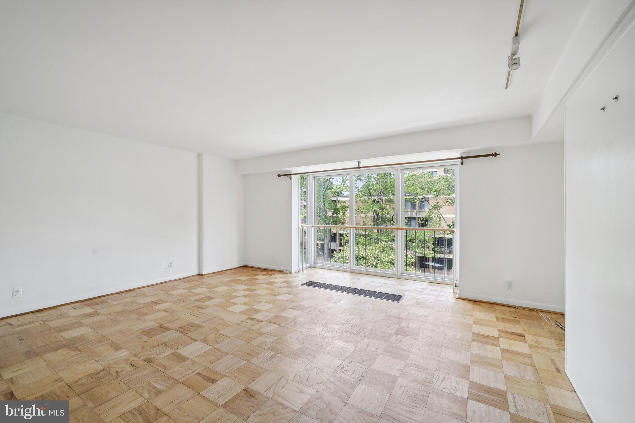 a view of an empty room with a window