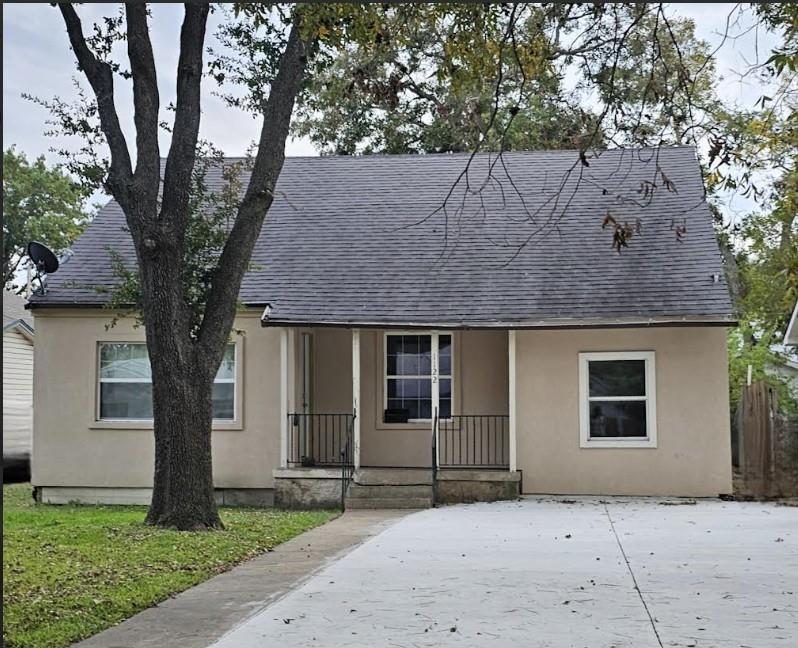 front view of a house with a yard