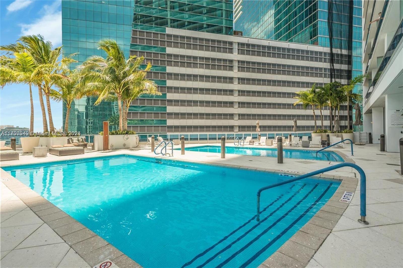 a view of a swimming pool with a lounge chairs