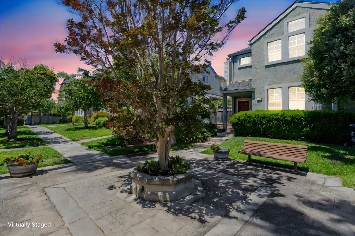 a view of backyard with outdoor seating and green space