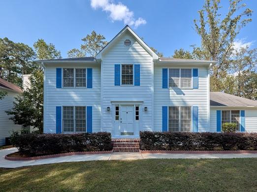 front view of a house with a yard