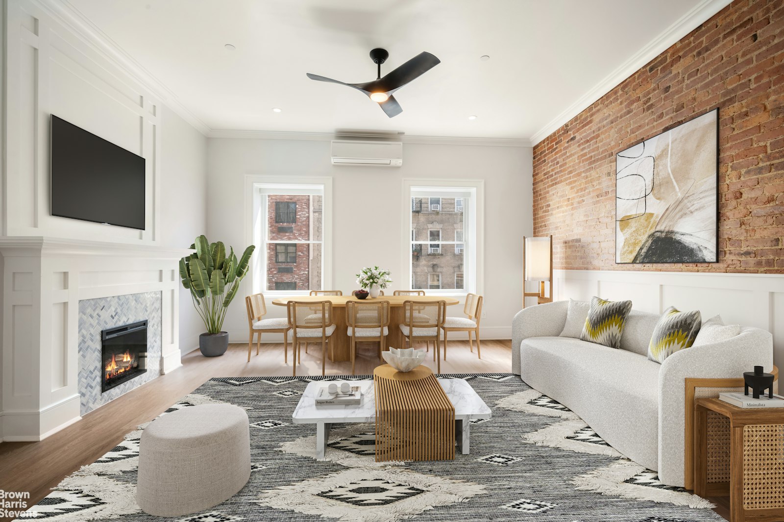 a living room with furniture a fireplace and a flat screen tv