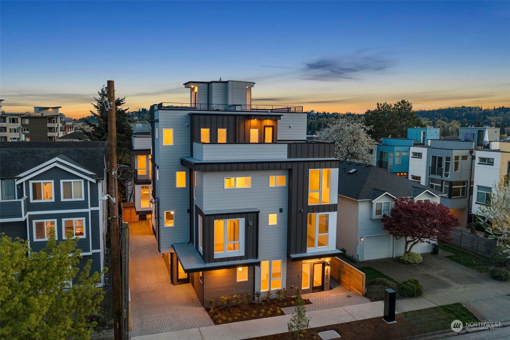 a front view of a residential apartment building with a yard