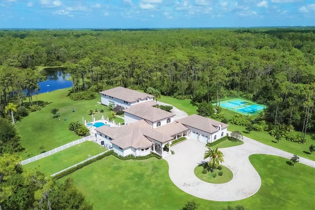 an aerial view of residential house with outdoor space and street view