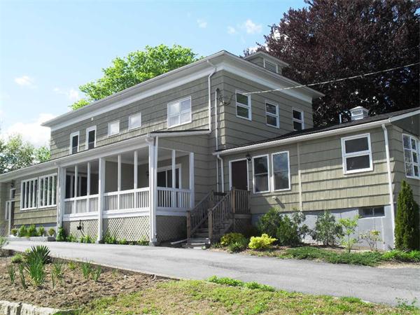 a front view of a house with a yard