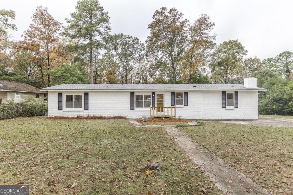 front view of a house with a yard