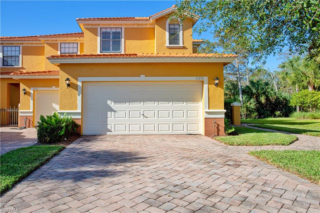 Mediterranean / spanish-style home with a garage