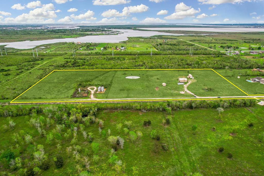 AERIAL VIEW WITH OUTLINE.  PROPERTY LINES ARE ESTIMATES ONLY.