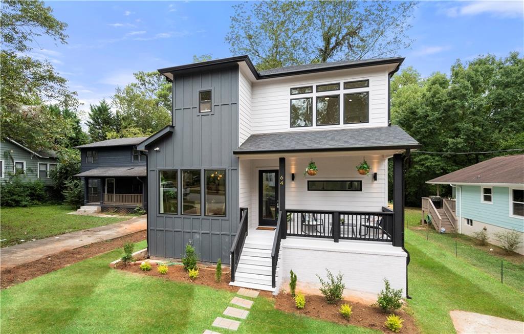 a view of a house with a yard patio and a fire pit