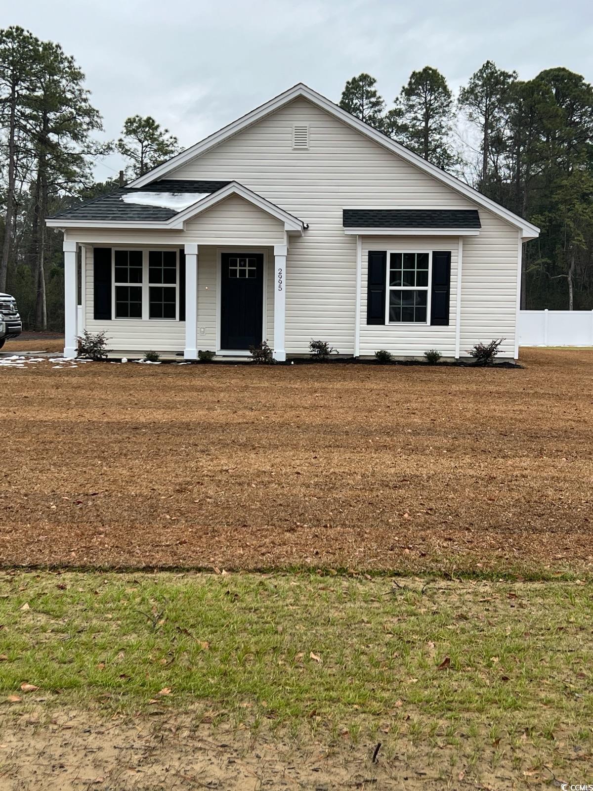 View of front of house with a front yard