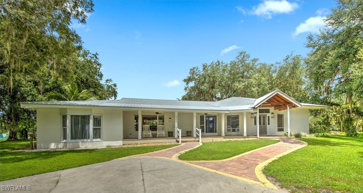 front view of a house with a yard