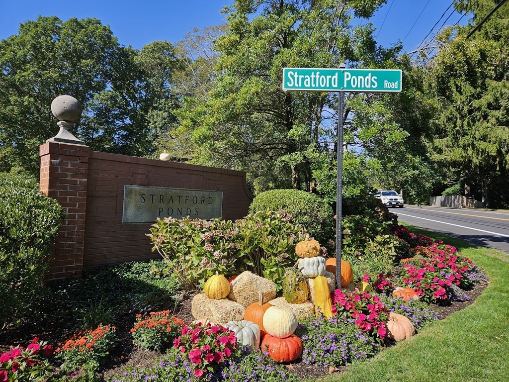 a sign that is in front of flowers