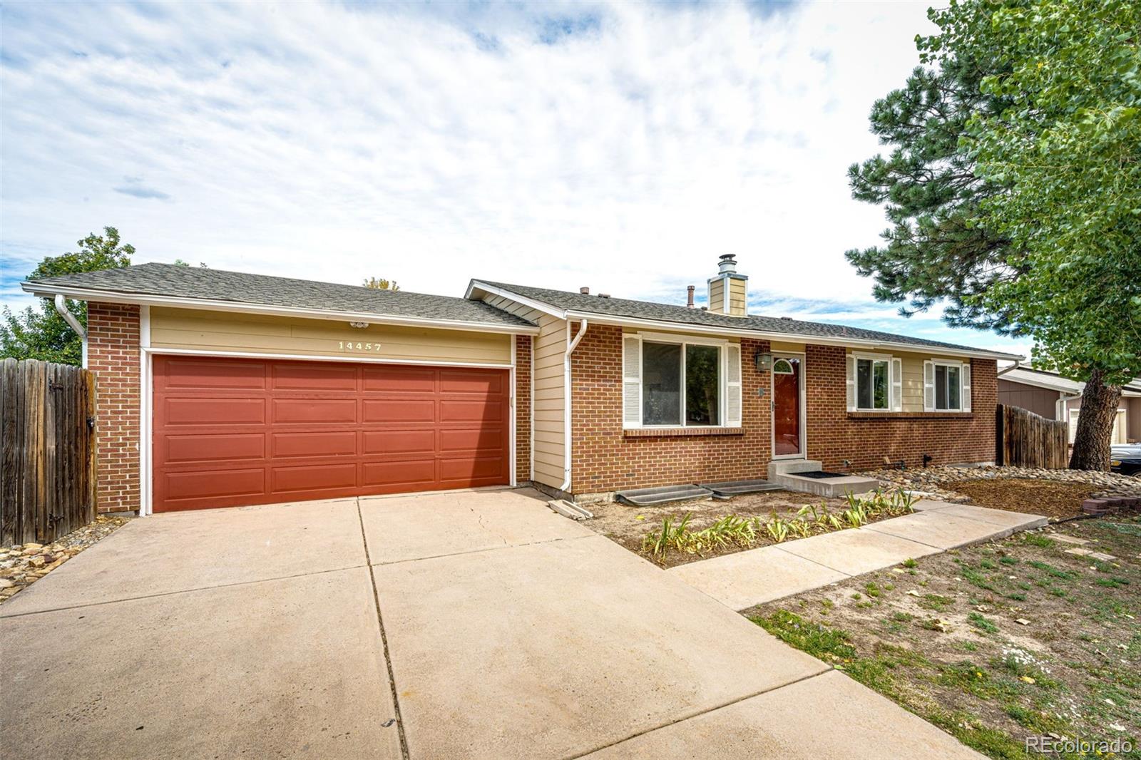 a front view of a house with a garage