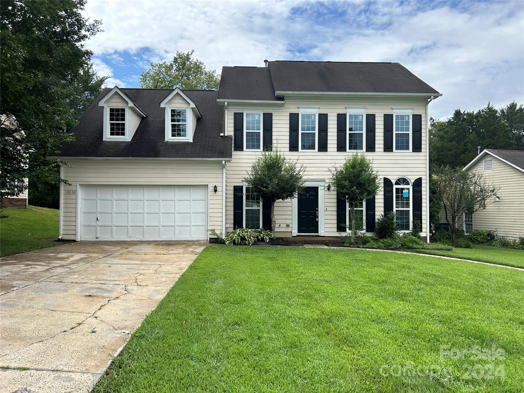 front view of a house with a yard