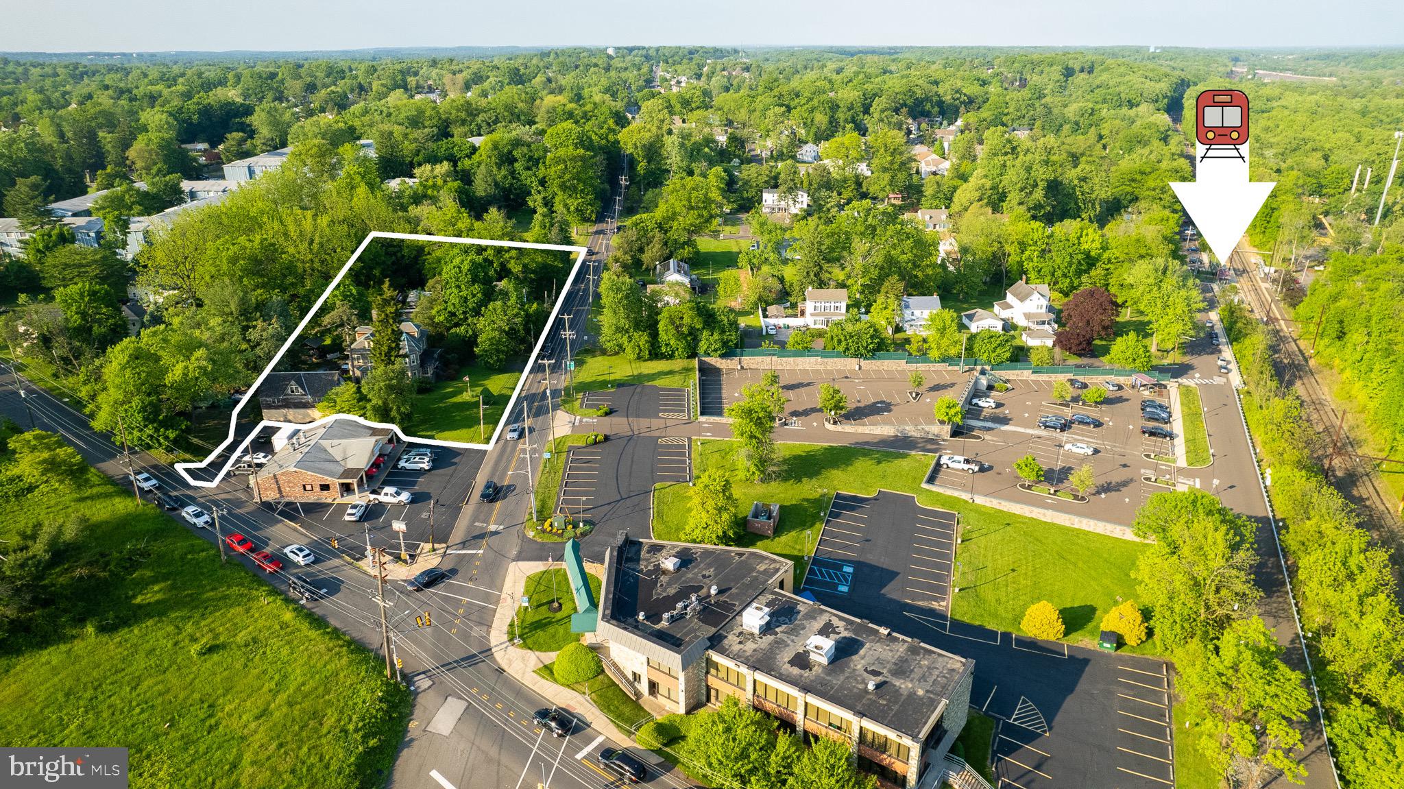 an aerial view of a house with a swimming pool