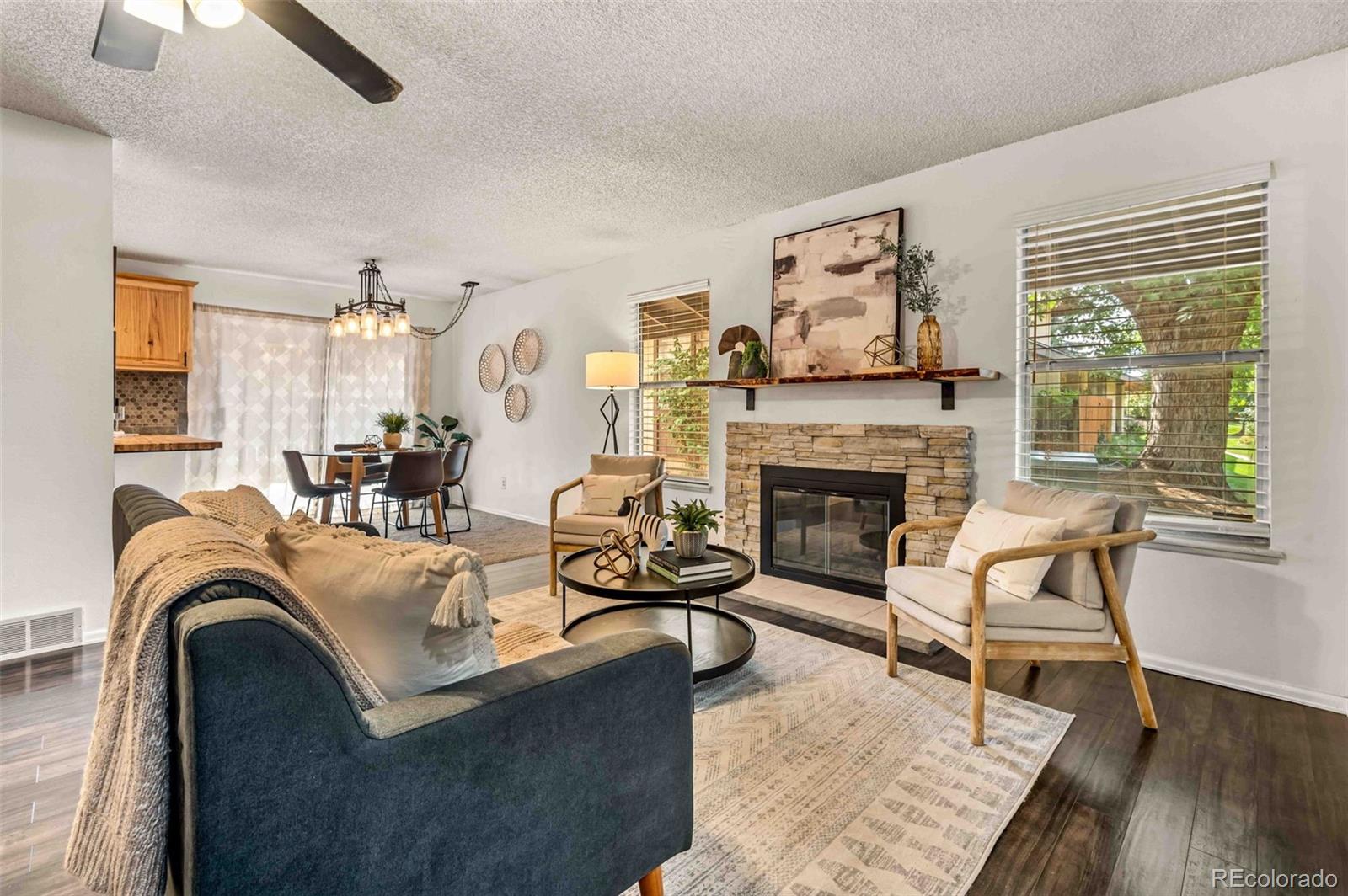 a living room with furniture and a fireplace