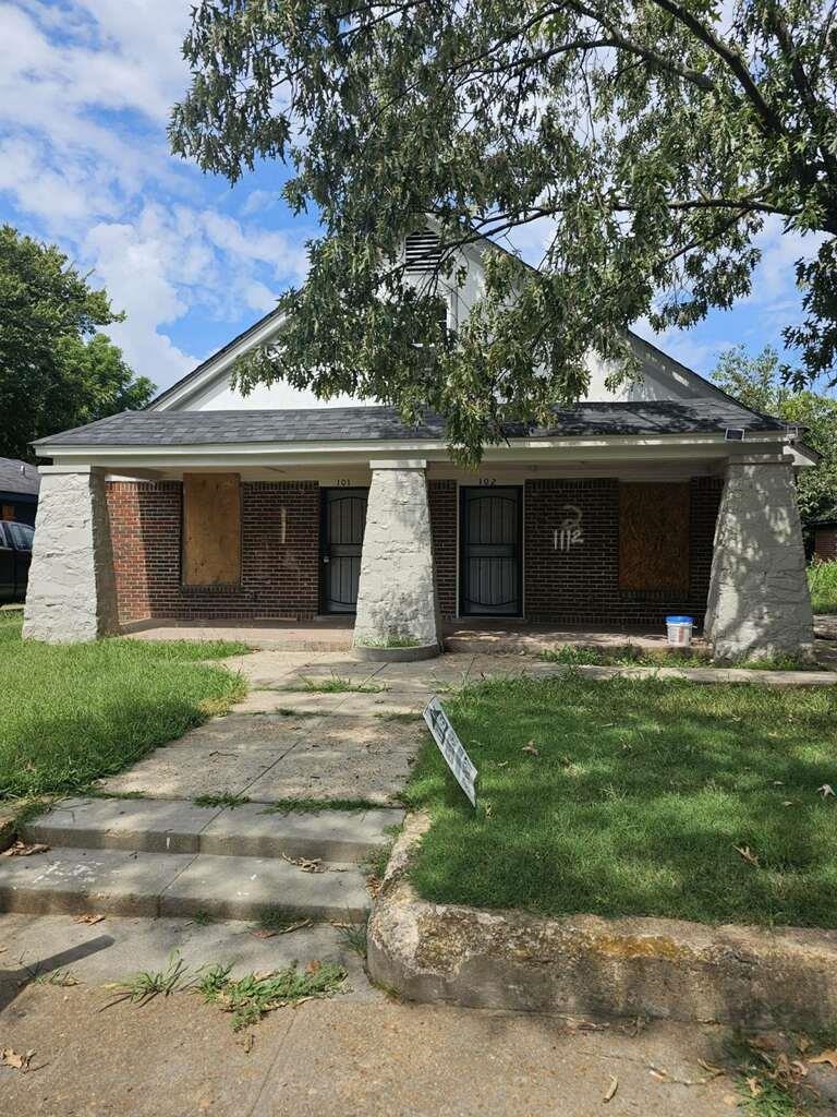 front view of a house with a garden