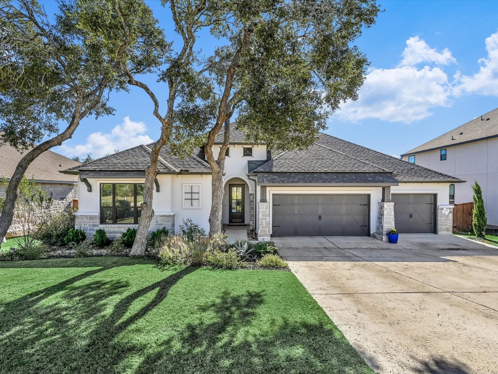 Welcome to 243 Bridge Water Loop. This ranch home features stunning curb appeal with stone and stucco exterior, lush landscaping, a 3-car garage, situated on an 80' wide lot.