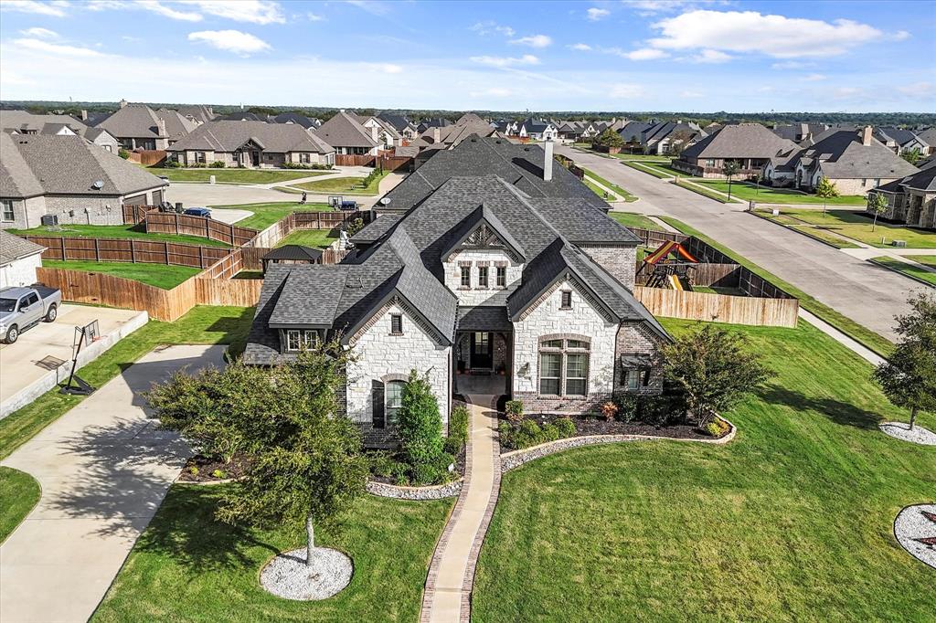 an aerial view of a house with a garden