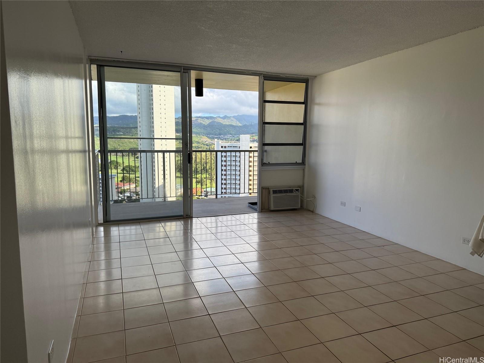 a view of an empty room and window