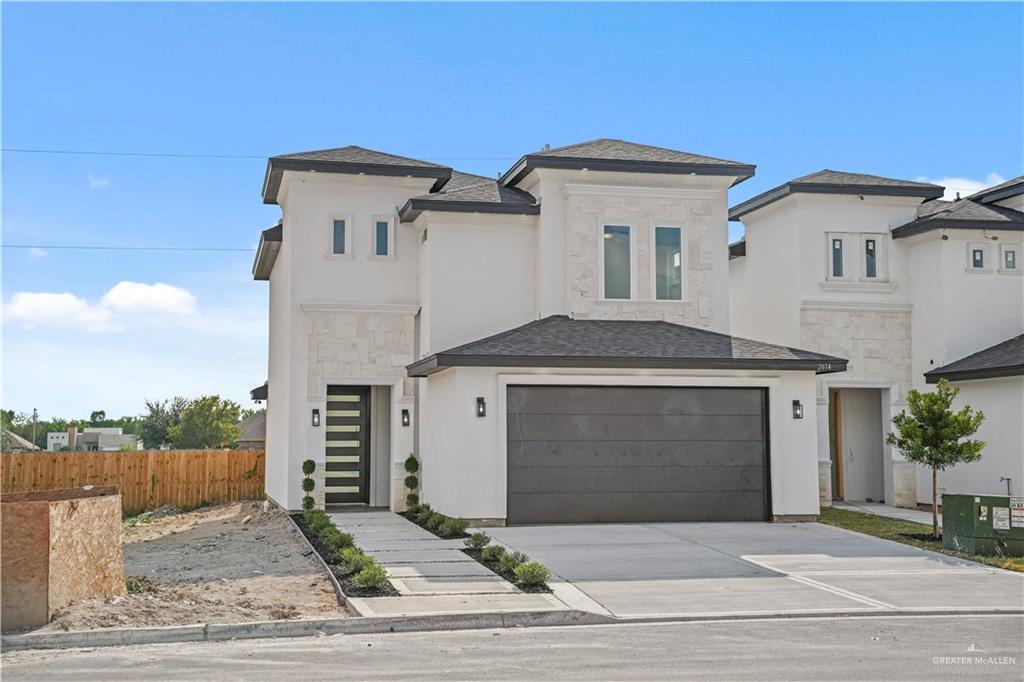 a front view of a house with a garage