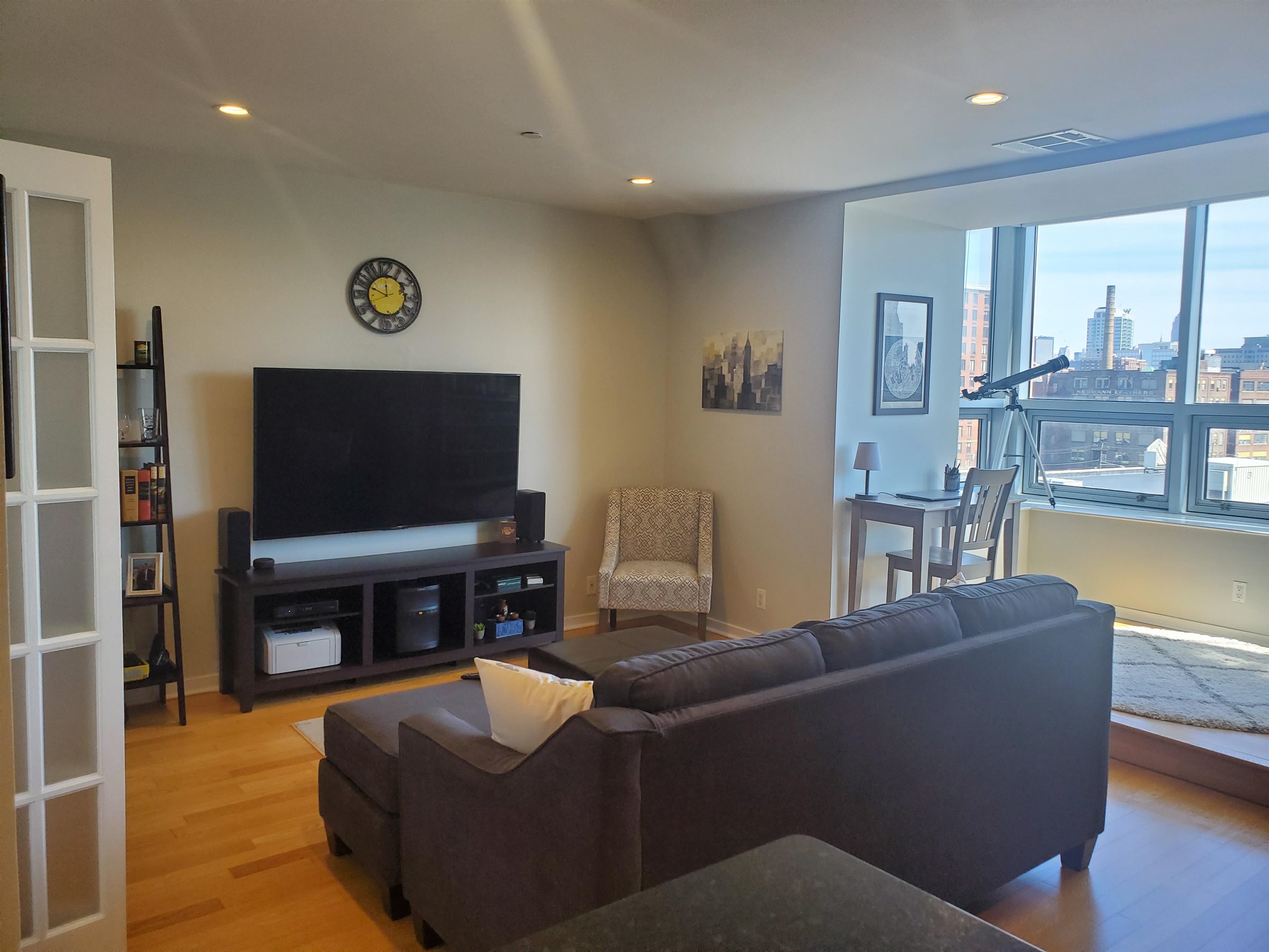 a living room with fireplace furniture and a flat screen tv