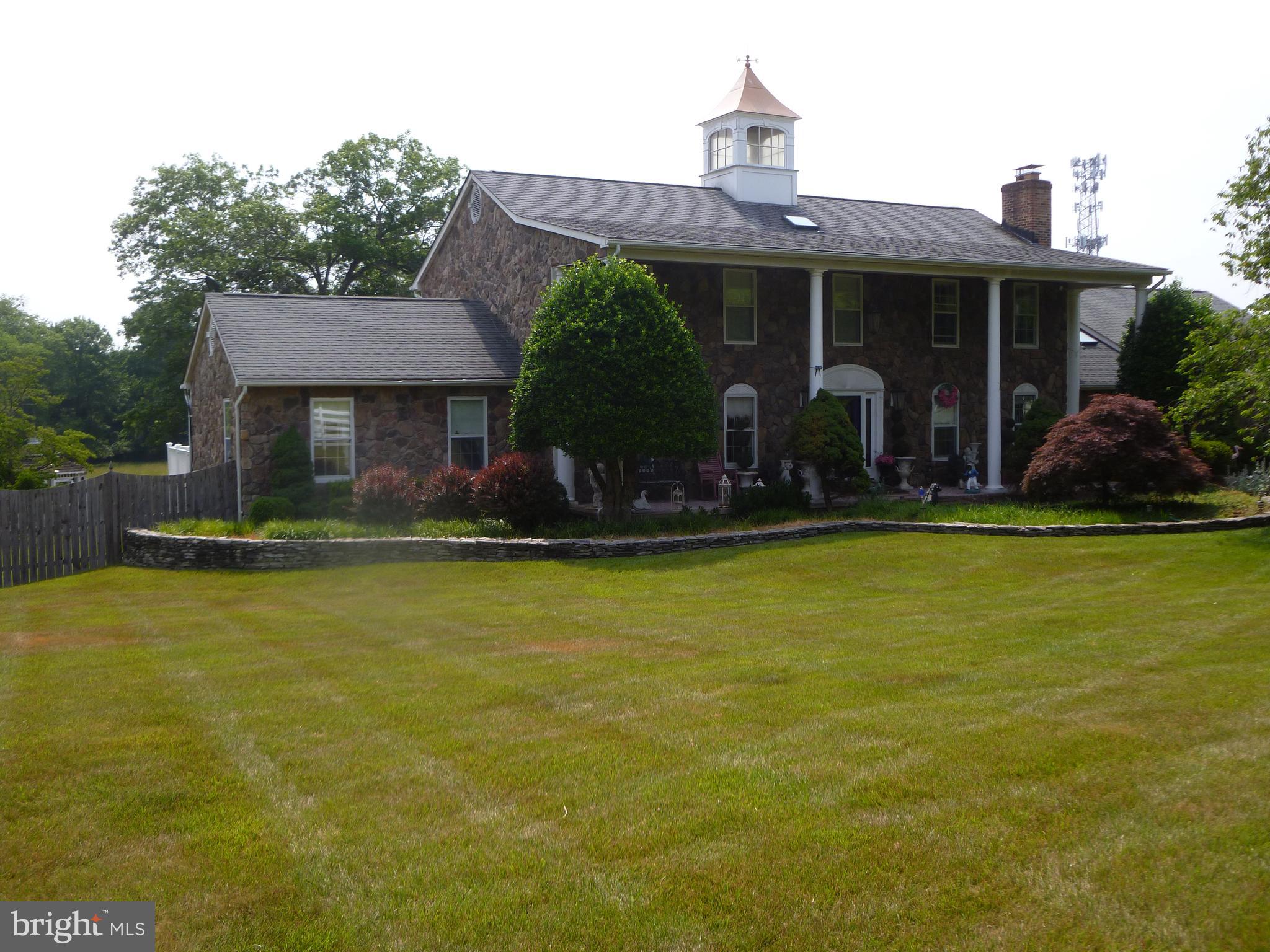 a view of a house with swimming pool and porch