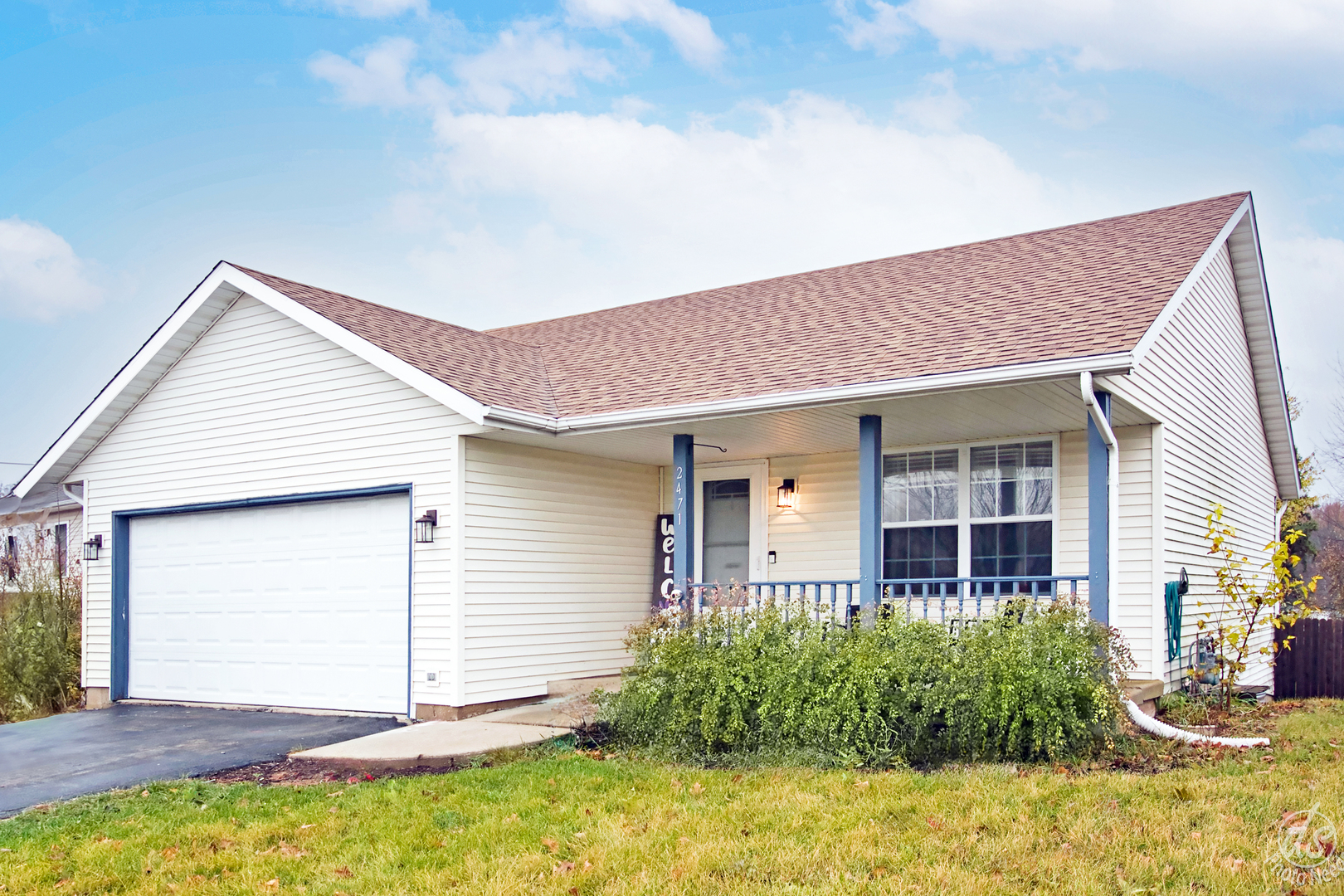 a front view of a house with garden