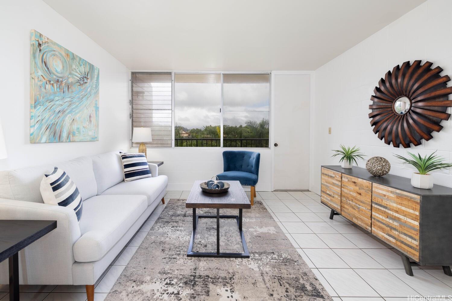 a living room with furniture and a large window