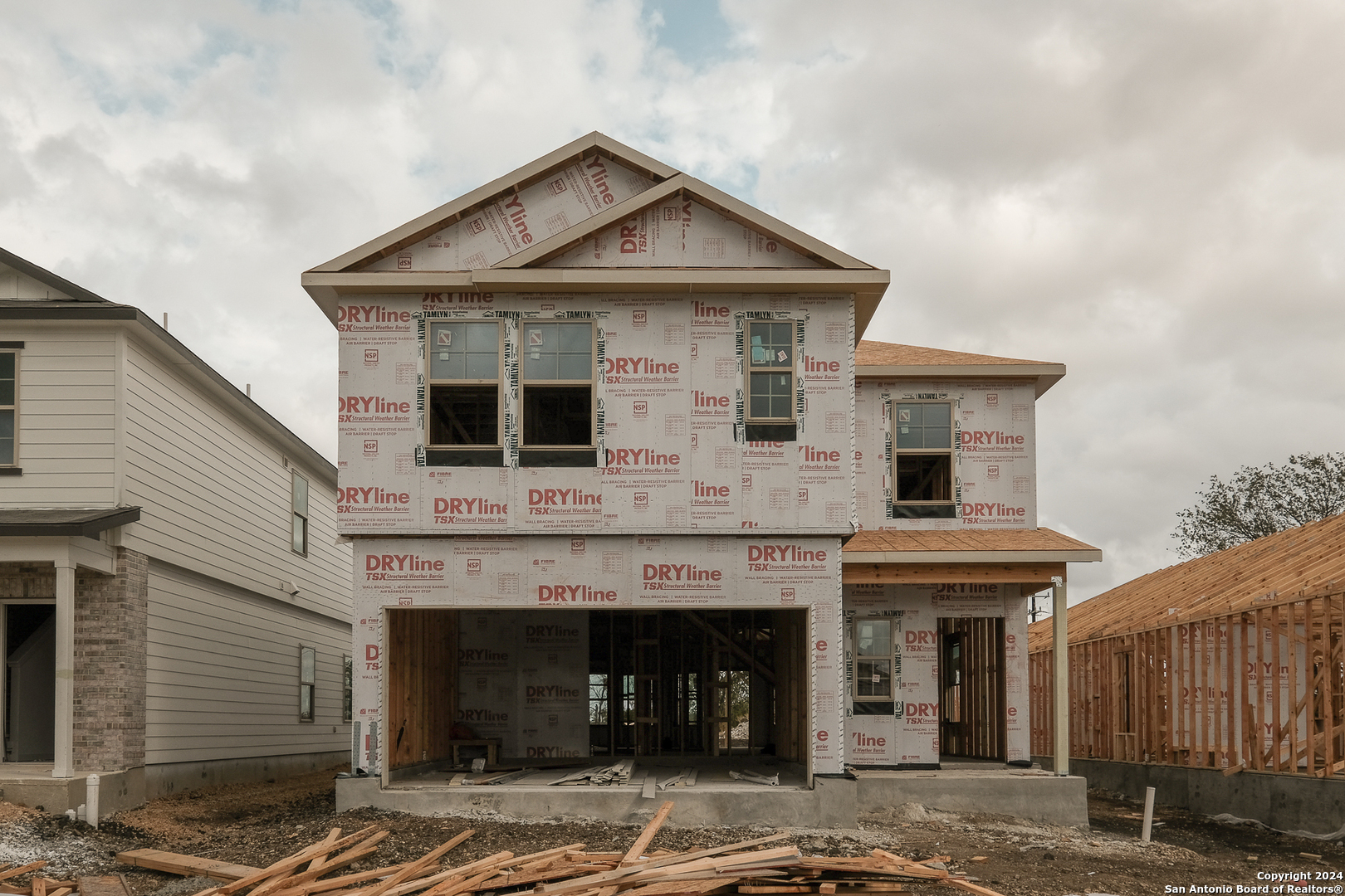 a front view of a house with a garage