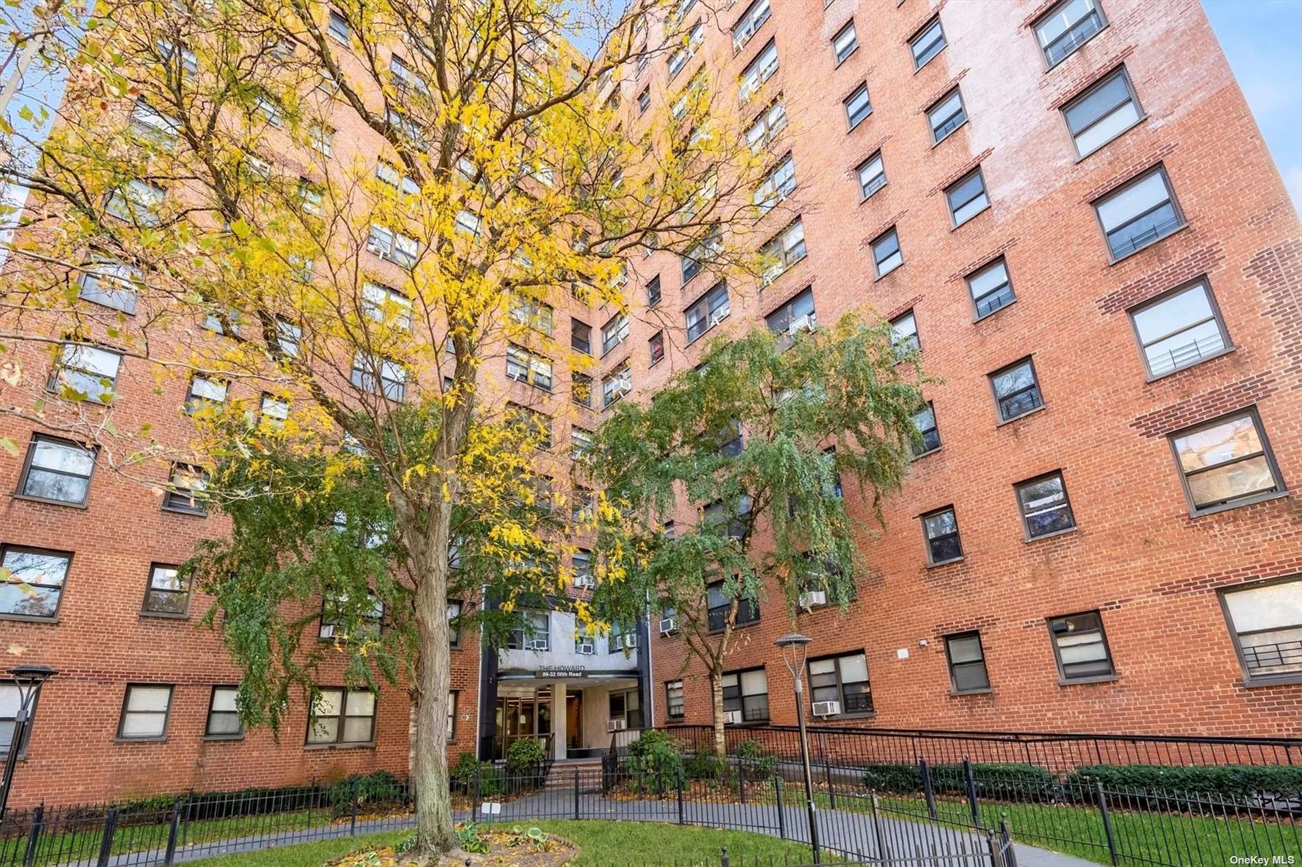 front view of a building with a trees