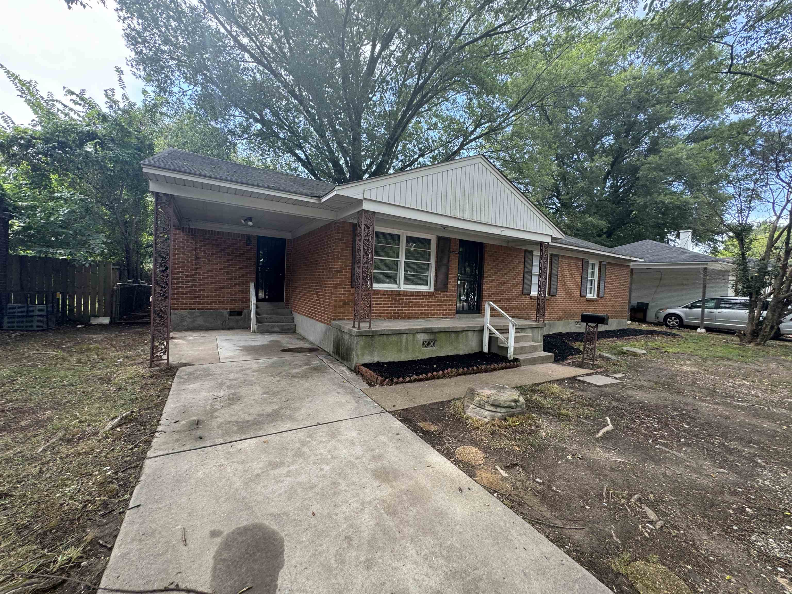 View of front of property with a carport