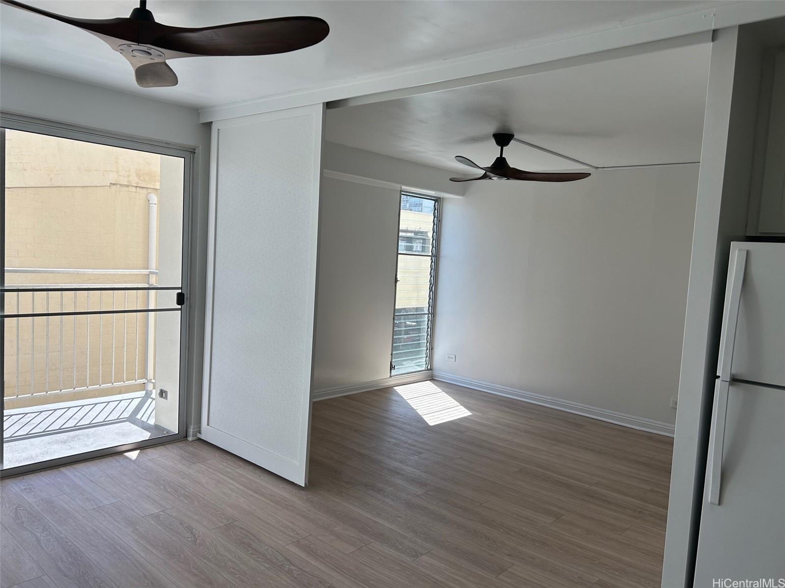 a view of an empty room with a window