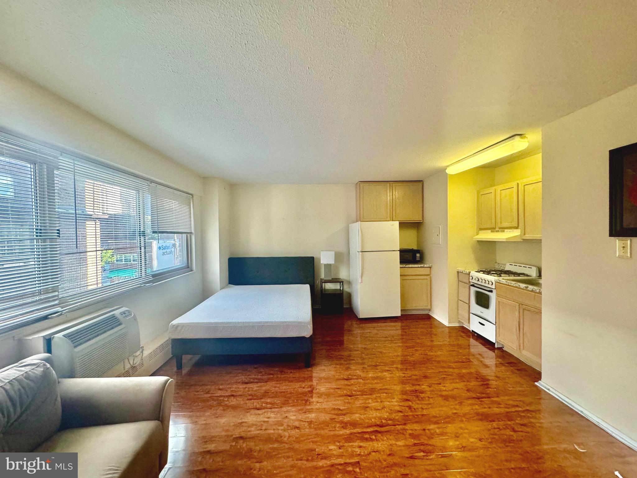 a living room with furniture and flat screen tv